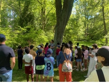 A group of people gathered outside.