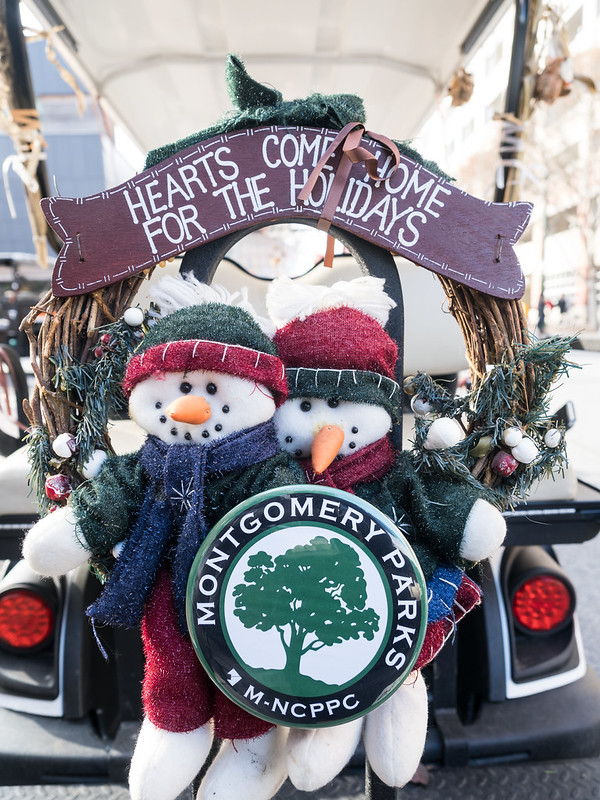 Stuffed snowmen on the back of Montgomery Parks parade vehicle.