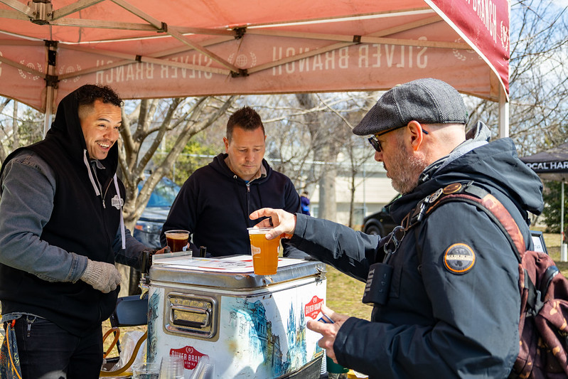 Attendee grabs beer from beer vendor