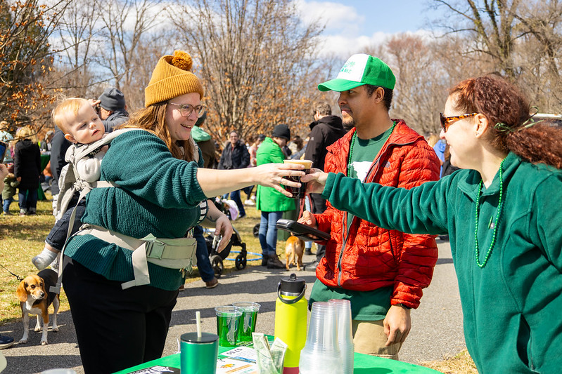 Attendee grabs a beer from a vendor