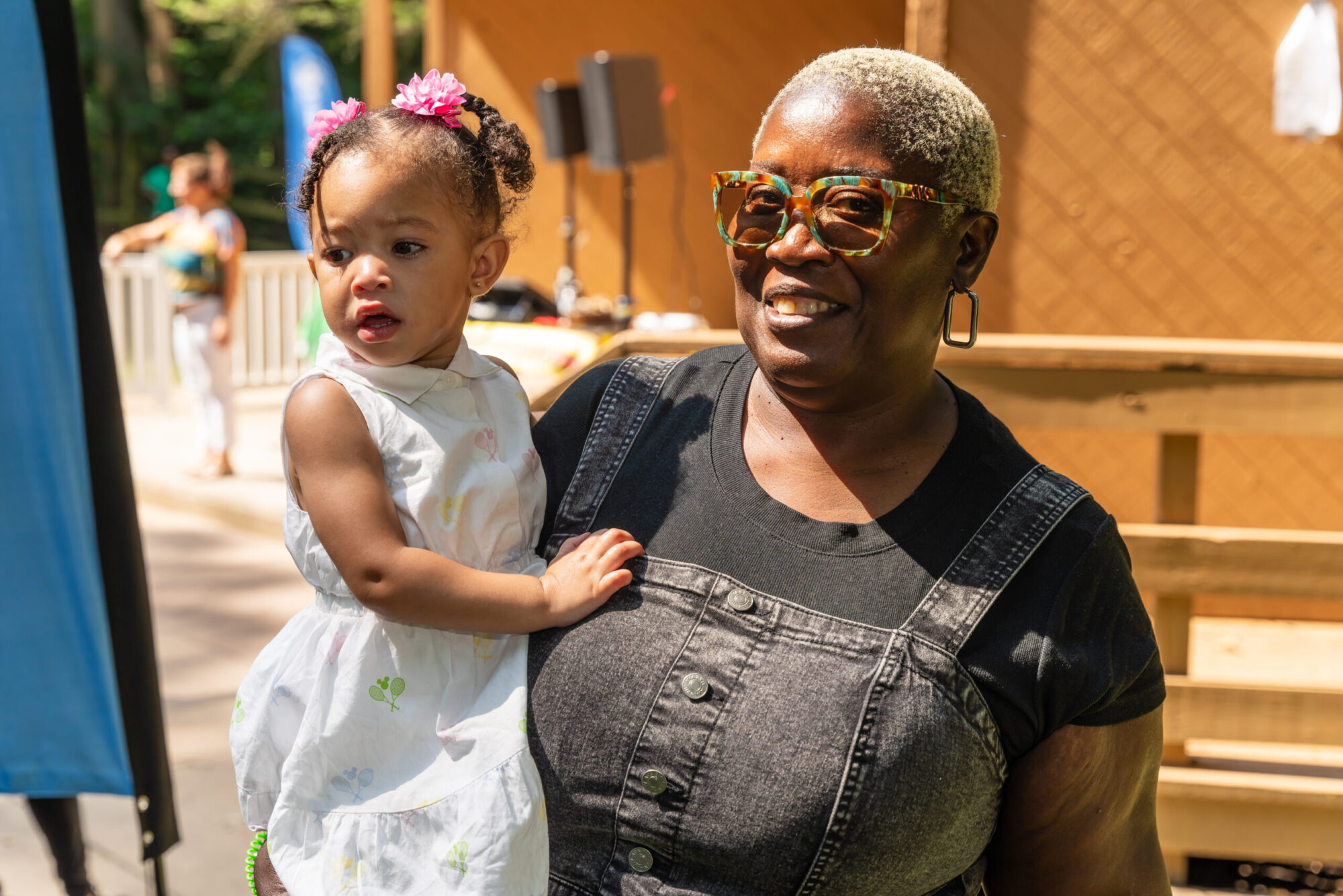 Parent and child smile for camera
