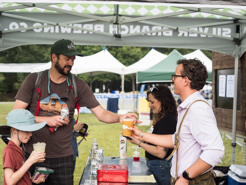 Attendee grabs beer from vendor at Parks Ale Trail