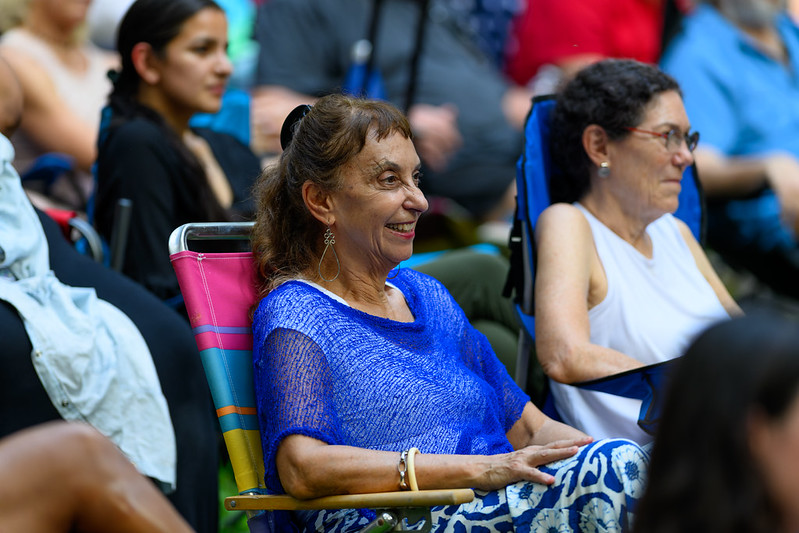 Attendee smiles in crowd