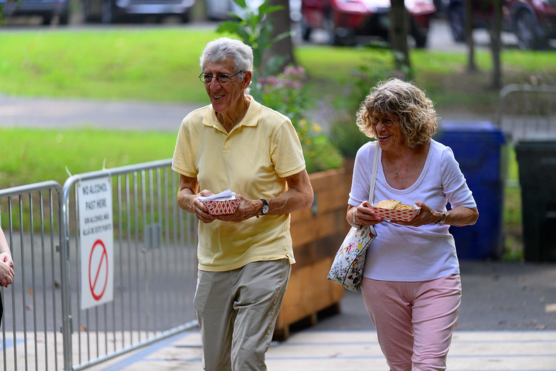 Attendees walking with food