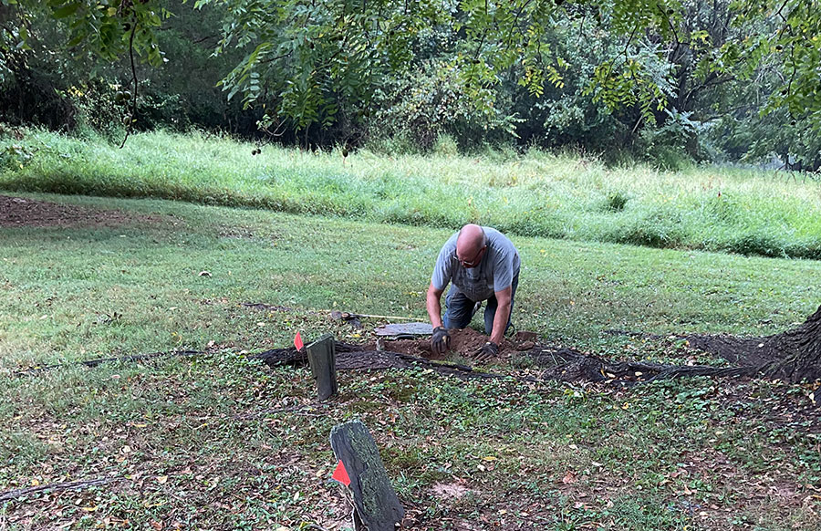Tombstone repair work by Howard Wellman at the Montgomery Chapel Cemetery