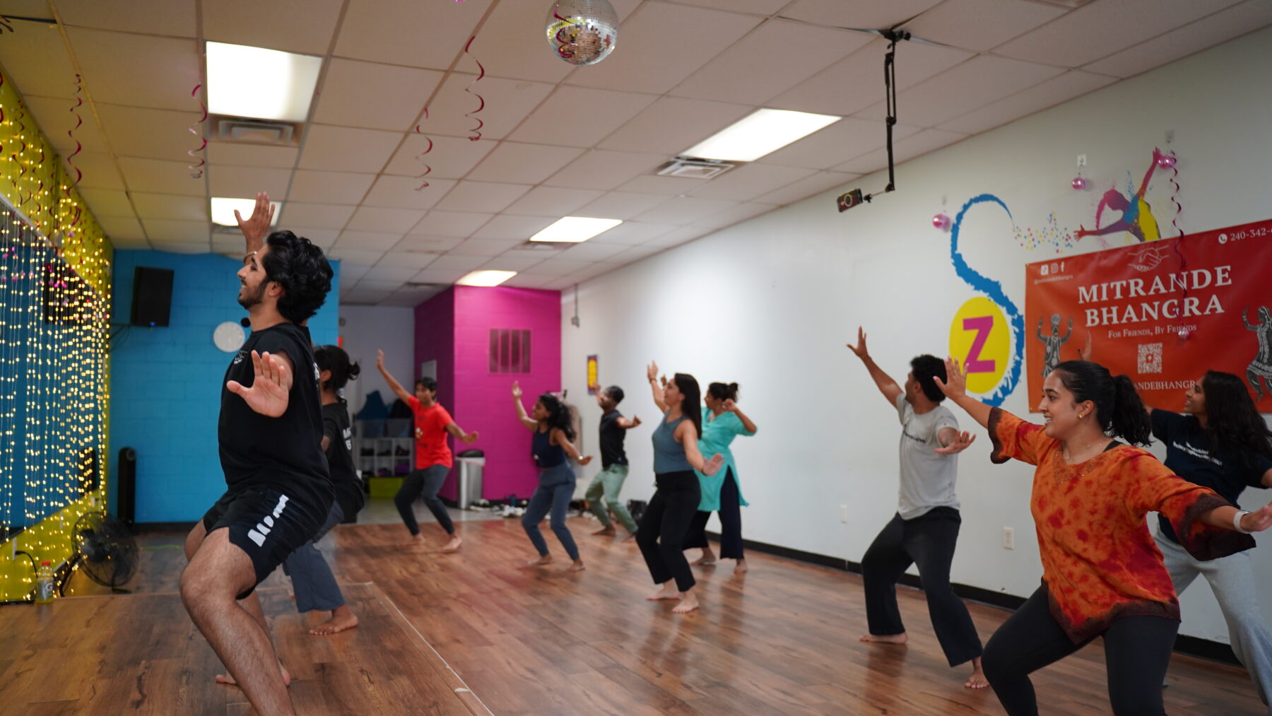 Attendees follow instructor performing the Bhangra Dance
