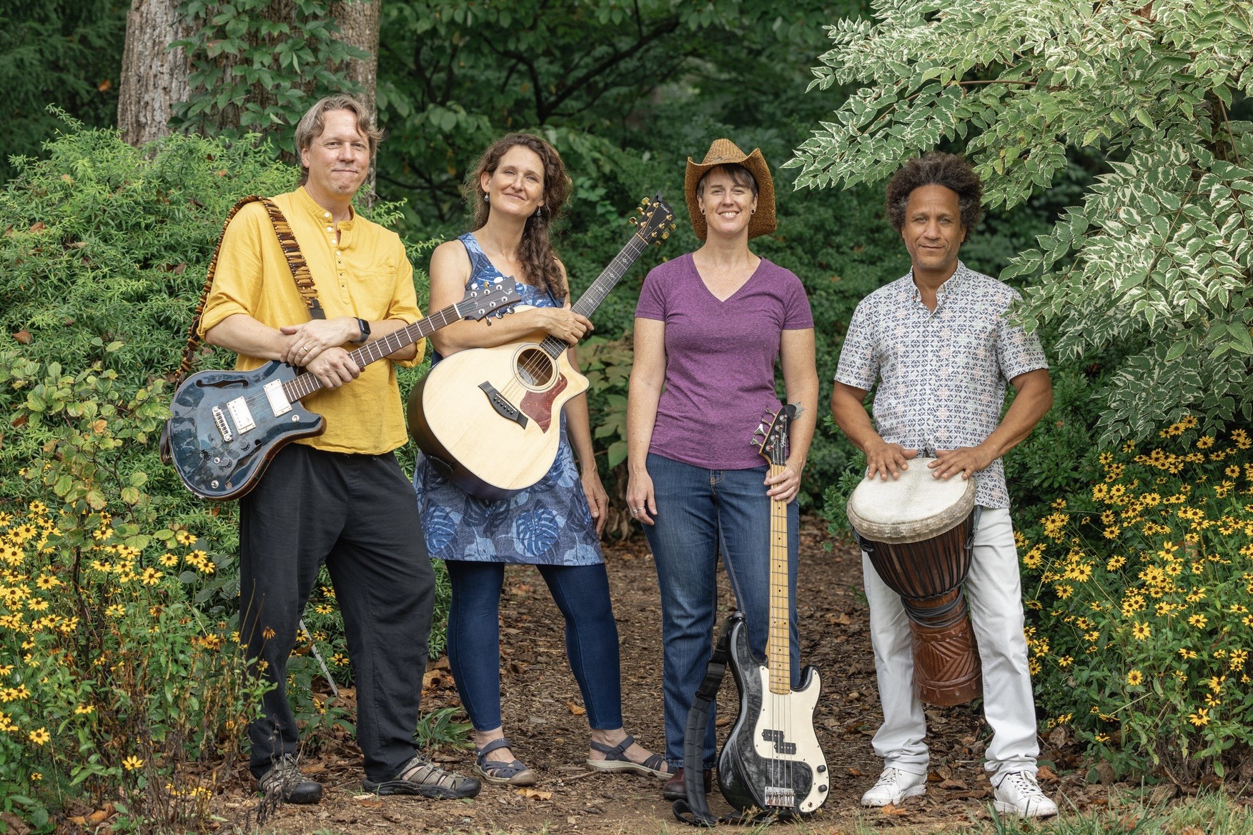Band members standing together with their instruments