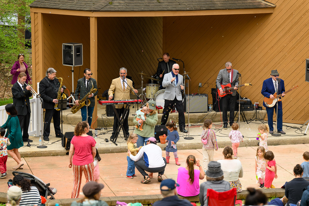 A band performs in front of an audience during a Sunday Serenade concert.