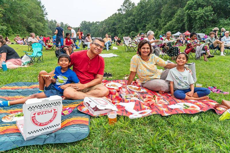 Family-having-picnic-at-summer-concert