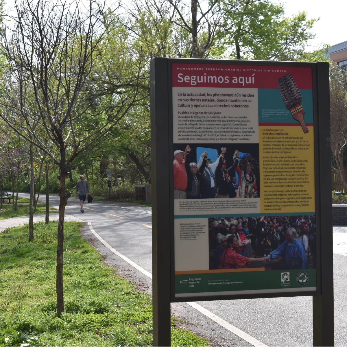 A photo of an interpretive sign installed next to a trail