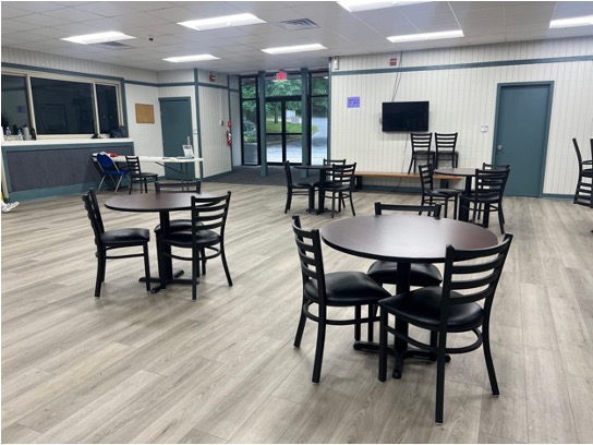 4 round tables with chairs inside wheaton sports pavillion
