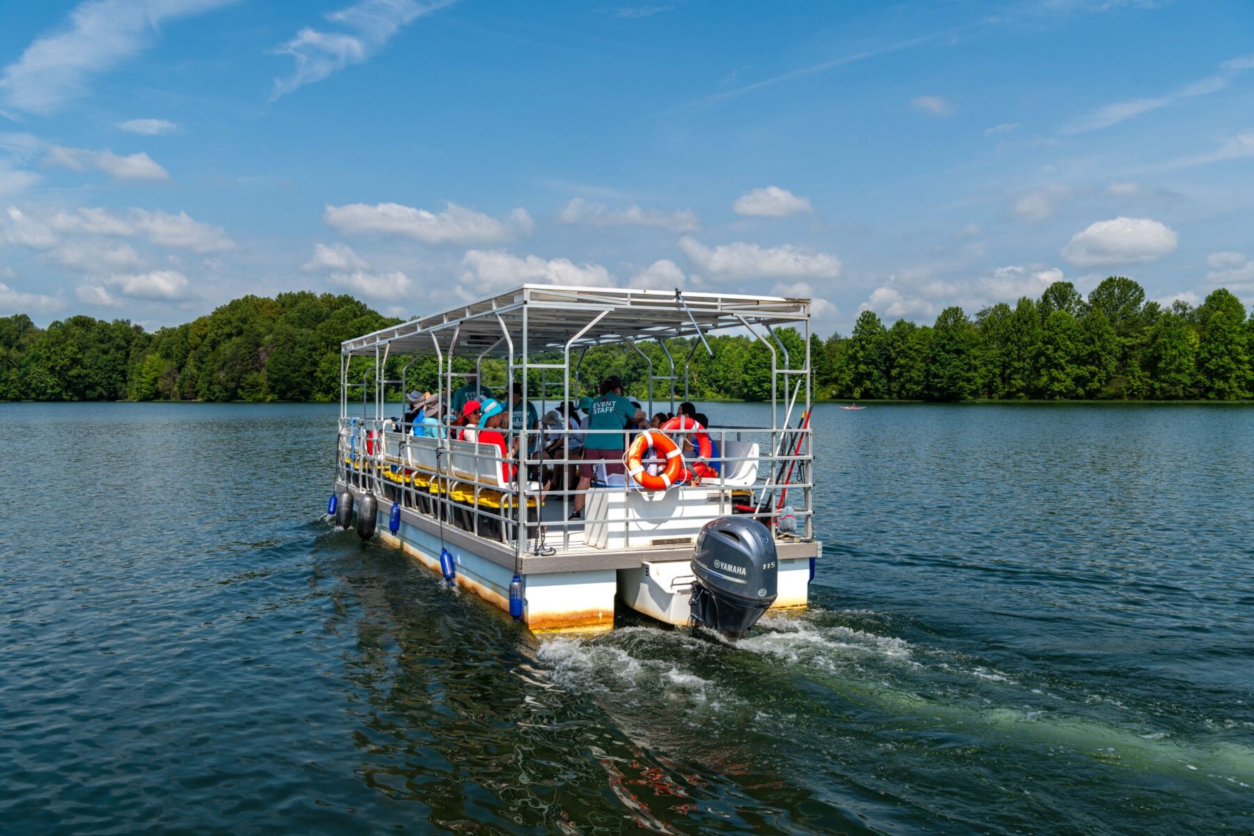 Pontoon boat motoring on Little Seneca Lake