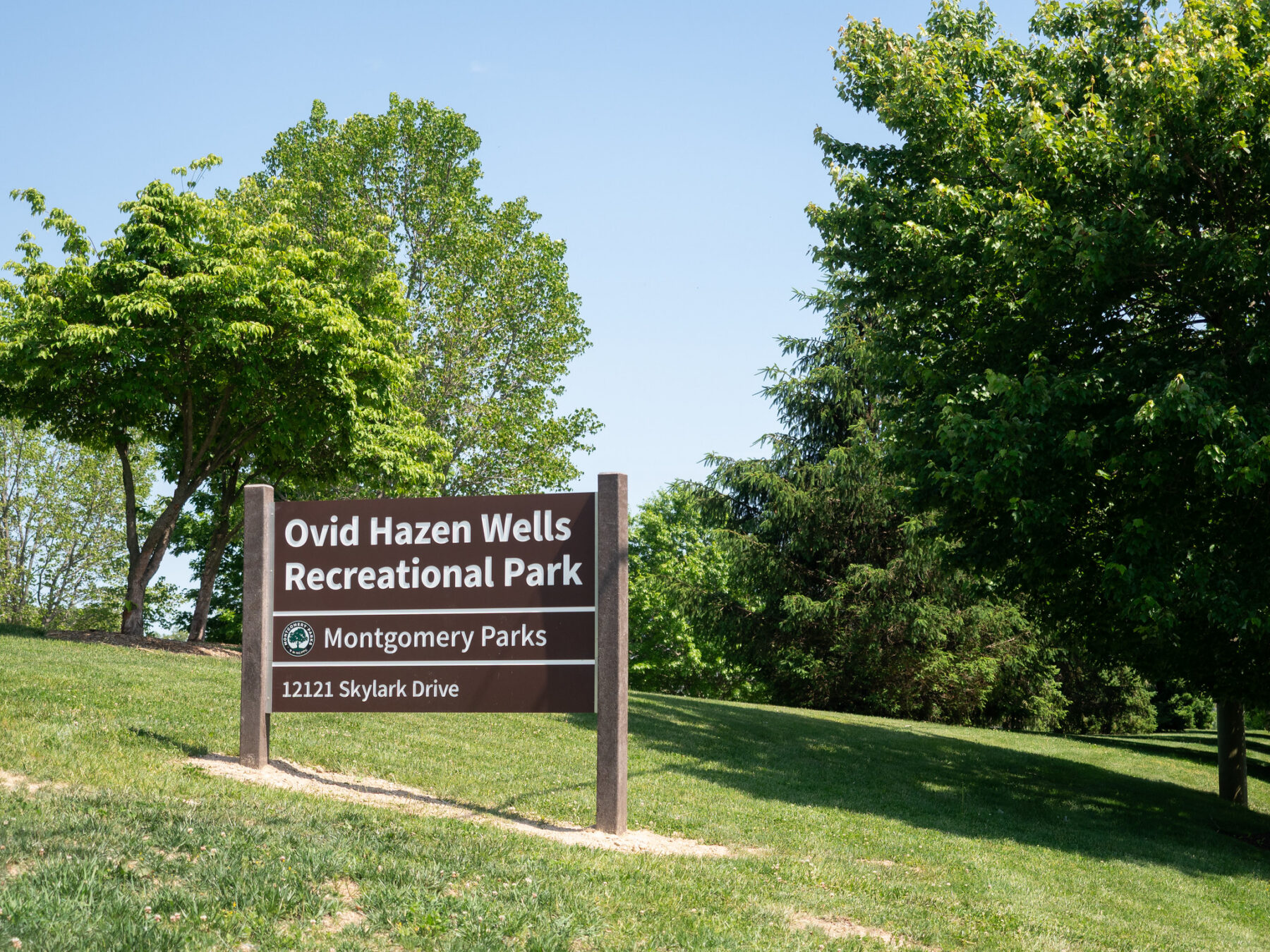 Ovid Hazen Wells Recreational Park sign outdoors at the park