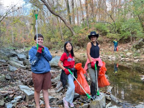 Volunteers cleaning up along a stream