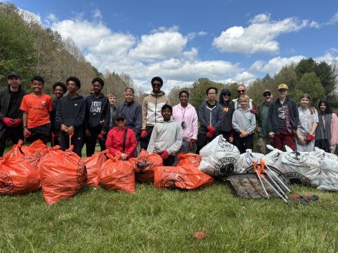 Group photo of volunteers after their park cleanup event