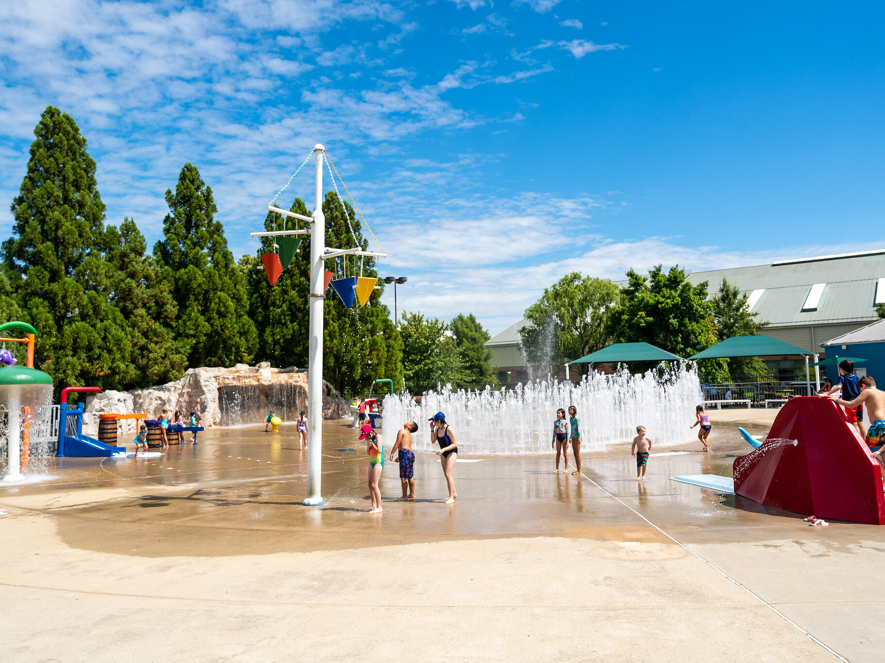 A wide view of South Germantown SplashPark shows several water features