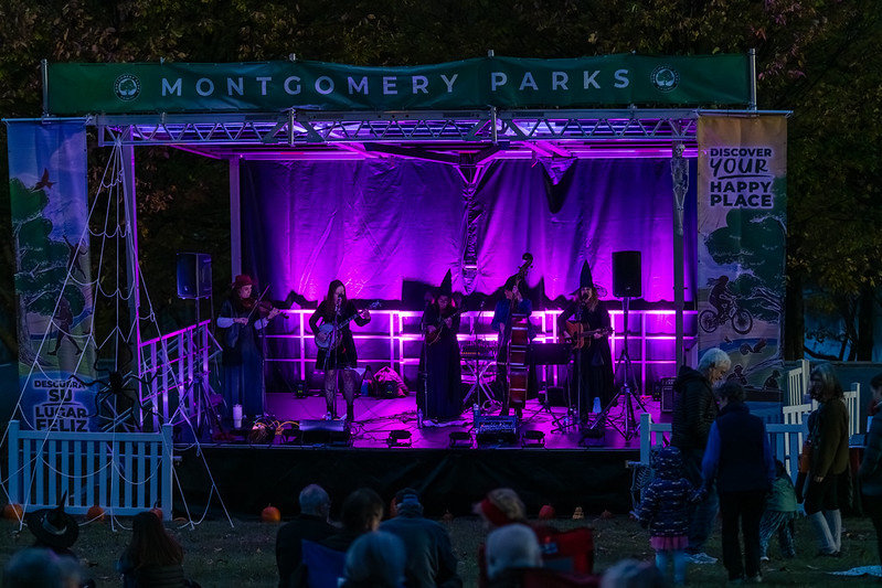 Stage lights up purple with band performing