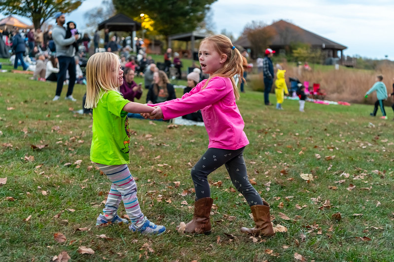 Children holding hands dancing
