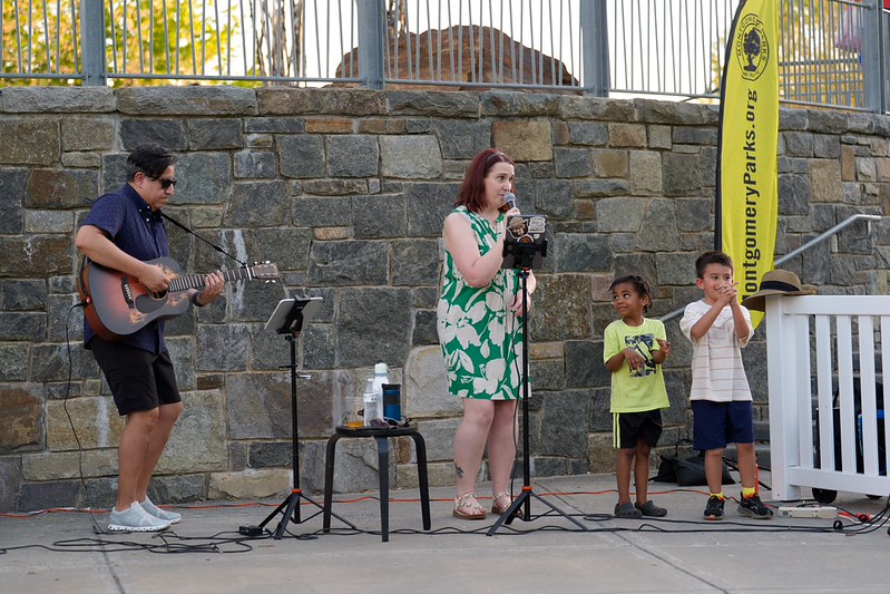 Emily & Jorge music band performs with two children dancing next to them