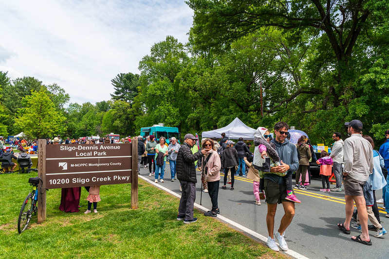 Attendees walk along Sligo Creek Parkway