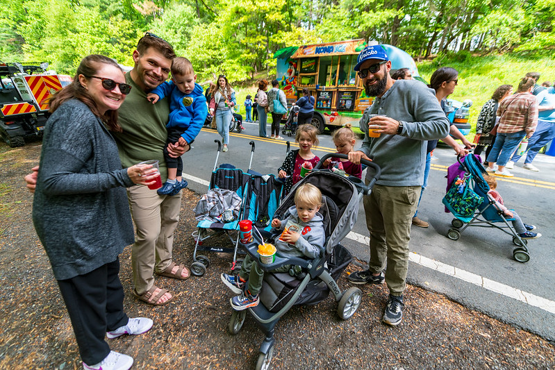 Attendees with children pose for camera