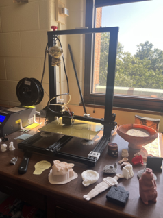 A table with an array of tools surrounding a larger piece of machinery
