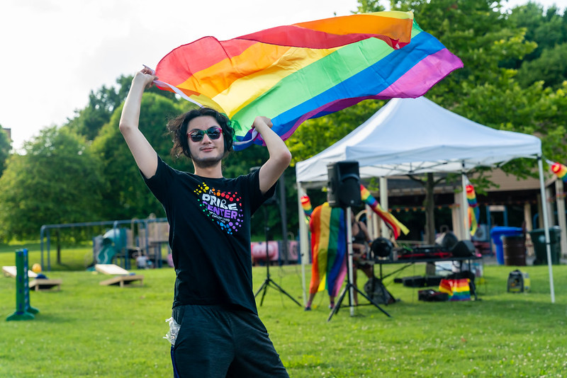 A person waving a pride flag