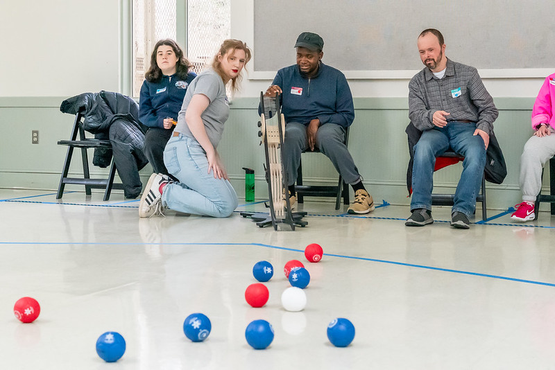 A group of people playing boccia.