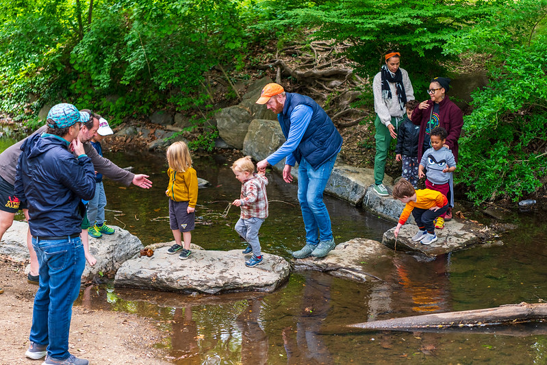 family-crosses-creek-at-Sligo